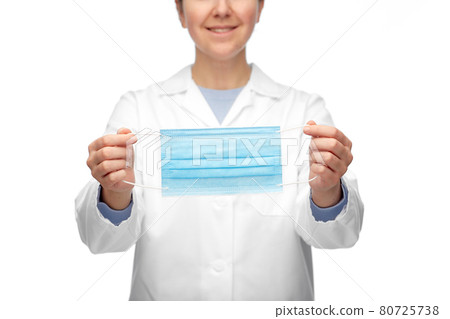 female doctor showing medical mask 80725738