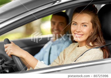 car driving school instructor teaching woman car driving school instructor teaching woman 80725996