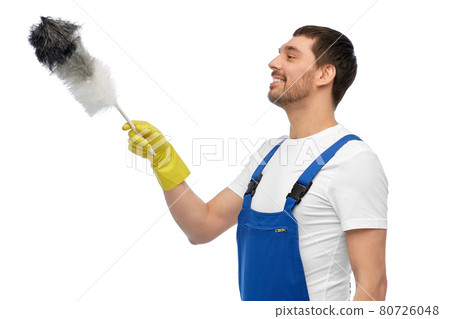 happy male worker or cleaner with duster cleaning happy male worker or cleaner with duster cleaning 80726048