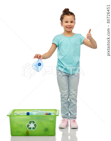 girl sorting plastic waste and showing thumbs up 80726451