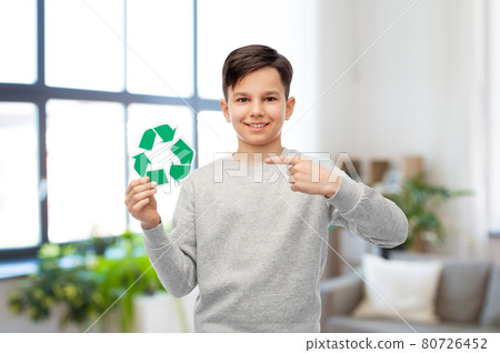 smiling boy showing green recycling sign 80726452