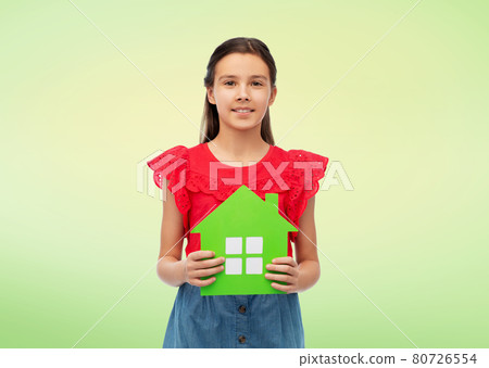 smiling little girl holding green house icon smiling little girl holding green house icon 80726554