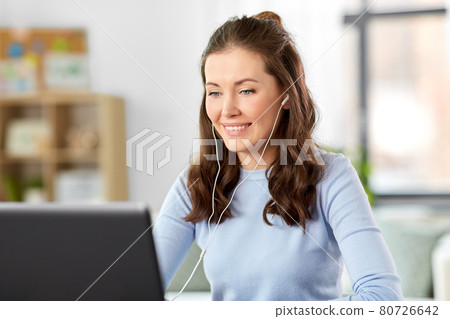 teacher with laptop having online class at home teacher with laptop having online class at home 80726642