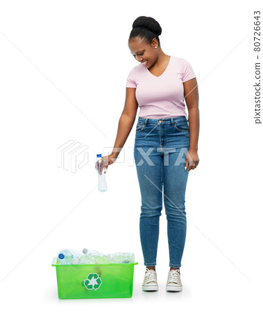 smiling young asian woman sorting plastic waste 80726643