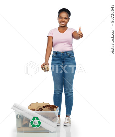 happy african american woman sorting paper waste 80726645