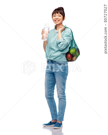 woman with food in string bag and glass bottle woman with food in string bag and glass bottle 80727027