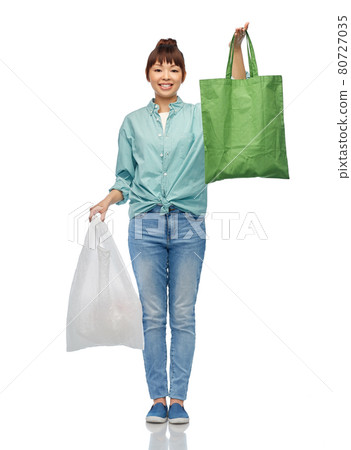 woman with plastic and reusable shopping bag woman with plastic and reusable shopping bag 80727035