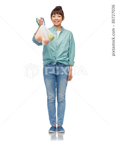 happy woman with apples in reusable net bag happy woman with apples in reusable net bag 80727036