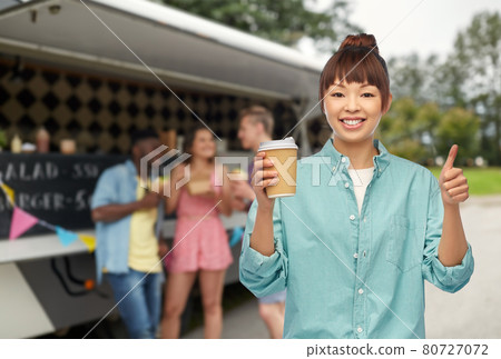 asian woman with coffee cup showing thumbs up asian woman with coffee cup showing thumbs up 80727072