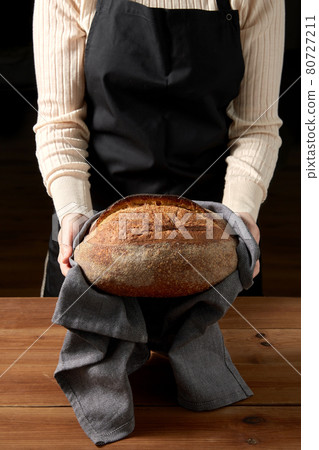 female baker with homemade bread at bakery female baker with homemade bread at bakery 80727211