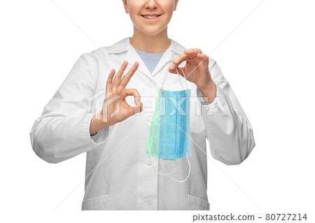 smiling doctor with two masks showing ok sign smiling doctor with two masks showing ok sign 80727214