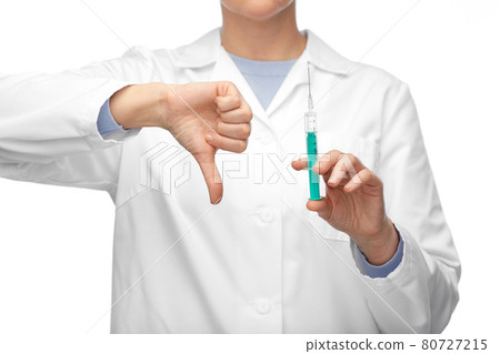close up of doctor with syringe shows thumbs down 80727215