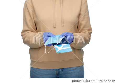 woman with mask, passport and air ticket woman with mask, passport and air ticket 80727216