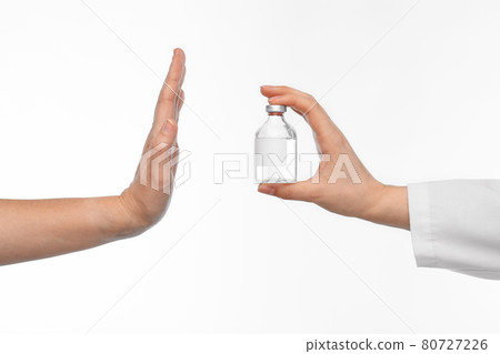 hand with medicine and showing stop gesture 80727226