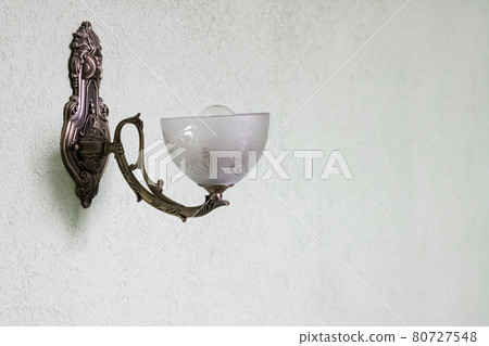 Lamp sconces on the wall close up Lamp sconces on the wall close up 80727548