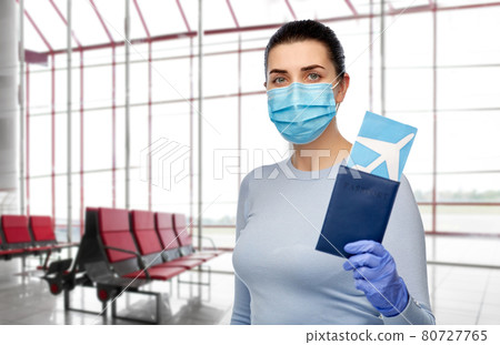 young woman in mask with air ticket and passport young woman in mask with air ticket and passport 80727765