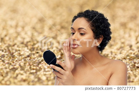 african american woman looking to mirror african american woman looking to mirror 80727773