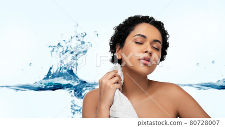 young african american woman with bath towel young african american woman with bath towel 80728007