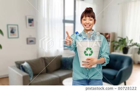 smiling young asian woman sorting plastic waste smiling young asian woman sorting plastic waste 80728122