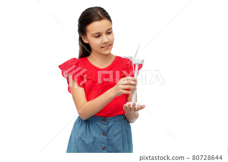 smiling girl with toy wind turbine smiling girl with toy wind turbine 80728644