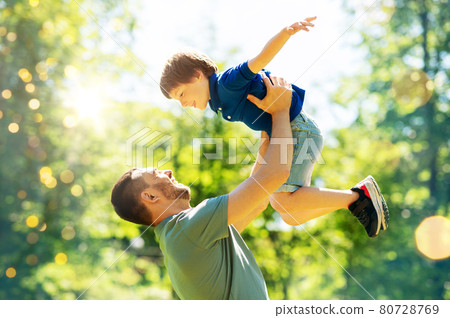 happy father with son playing in summer park happy father with son playing in summer park 80728769