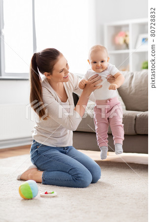 happy mother playing with little baby at home happy mother playing with little baby at home 80728832