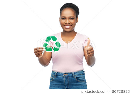 smiling asian woman holding green recycling sign smiling asian woman holding green recycling sign 80728833