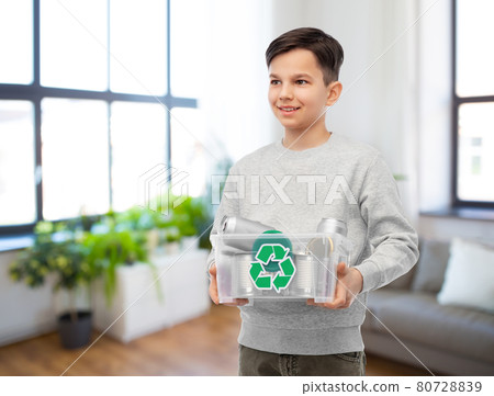smiling boy sorting metallic waste smiling boy sorting metallic waste 80728839