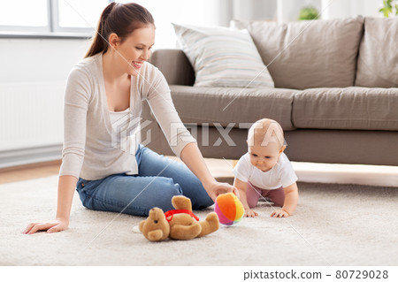 happy mother playing with little baby at home happy mother playing with little baby at home 80729028