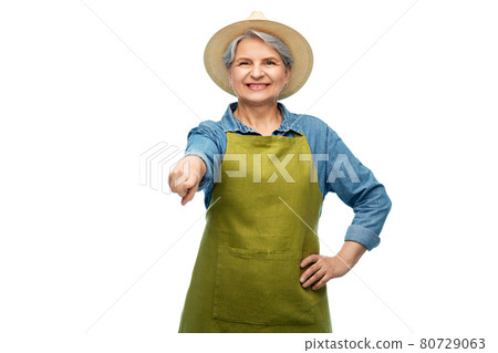 portrait of smiling senior woman in garden apron portrait of smiling senior woman in garden apron 80729063
