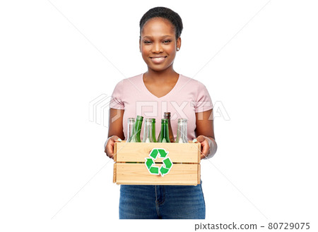 happy african american woman sorting glass waste happy african american woman sorting glass waste 80729075