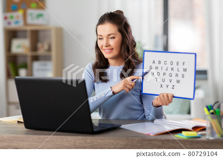 teacher with alphabet having online class at home teacher with alphabet having online class at home 80729104