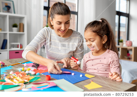 daughter with mother making applique at home daughter with mother making applique at home 80729253