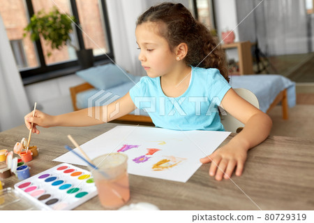 little girl with colors drawing picture at home little girl with colors drawing picture at home 80729319