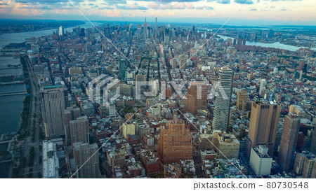 Aerial shot of the city with a group of buildings with a view of the sea in the distance 80730548