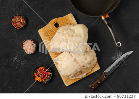 Overhead view of lamb fat tail on kitchen table Overhead view of lamb fat tail on kitchen table 80731227