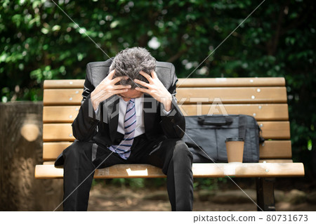 Businessmen worried outdoors 80731673