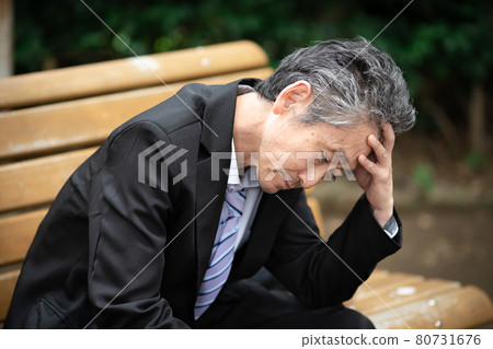 Businessmen worried outdoors 80731676