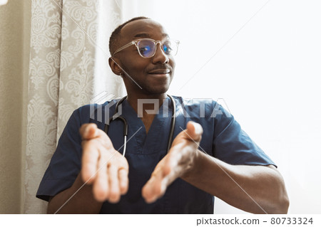 One african young doctor, therapeutic or medical advisor using laptop, consulting online. Concept of healthcare, care, medicine and professional occupation One african young doctor, therapeutic or medical advisor using laptop, consulting online. Concept of healthcare, care, medicine and professional occupation 80733324