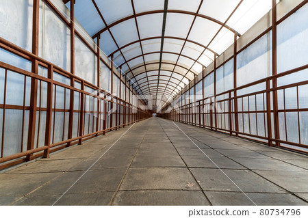 Tunnel Symmetrical Walkway with tiles on floor. Crossing the railway Tunnel Symmetrical Walkway with tiles on floor. Crossing the railway 80734796