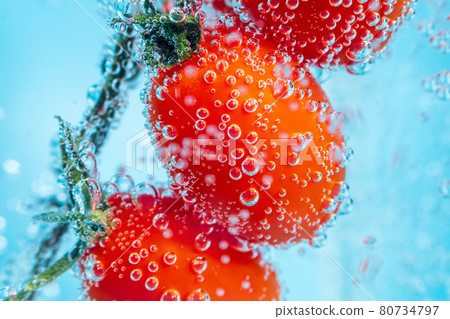 Red bell pepper close-up in the water under the water, selective micro focus Red bell pepper close-up in the water under the water, selective micro focus 80734797