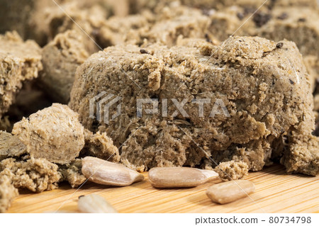 Sunflower halva close-up macro selective focus. Pieces of halva. Oriental sweets Sunflower halva close-up macro selective focus. Pieces of halva. Oriental sweets 80734798