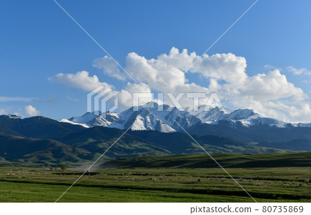 Mountain landscape with clouds and road, Kazakhstan, Almaty region 80735869