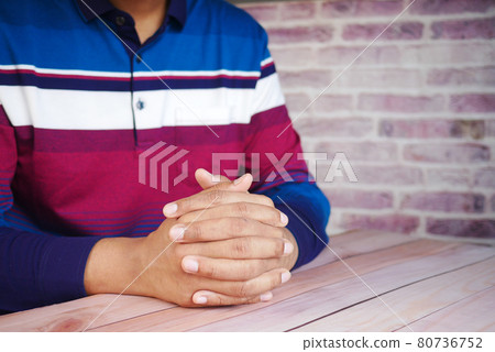 a nervous young man hand a nervous young man hand 80736752