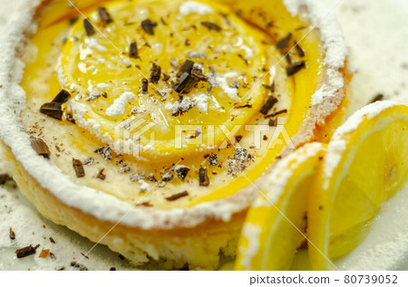 Tarte au Citron deliciously rich and zingy lemon creme encased in crumbly, buttery pastry case gently baked to perfectly complement the creamy filling Tarte au Citron deliciously rich and zingy lemon creme encased in crumbly, buttery pastry case gently baked to perfectly complement the creamy filling 80739052