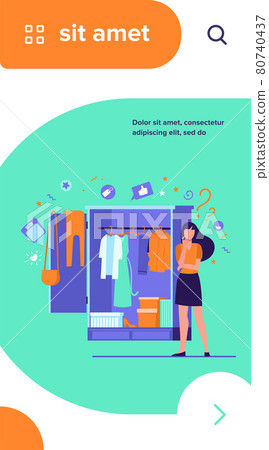 Woman standing at open wardrobe and choosing clothes 80740437