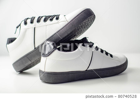 White sneakers with black laces, classic sports shoes White sneakers with black laces, classic sports shoes 80740528