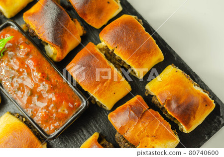 Patty's pies stuffed with minced meat, mushrooms and onion, served with sauce Patty's pies stuffed with minced meat, mushrooms and onion, served with sauce 80740600