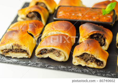 Patty's pies stuffed with minced meat, mushrooms and onion, served with sauce 80740602