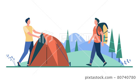 Two tourists pitching tent on meadow 80740780